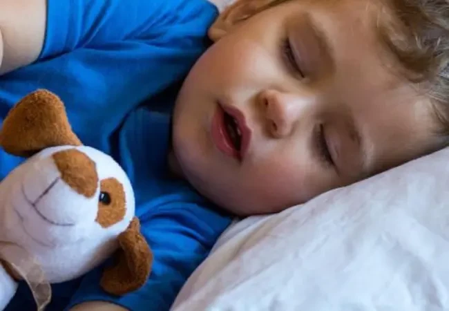 Parent observing child snoring during sleep